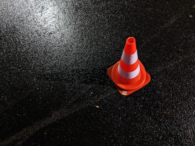 orange traffic cone on the road