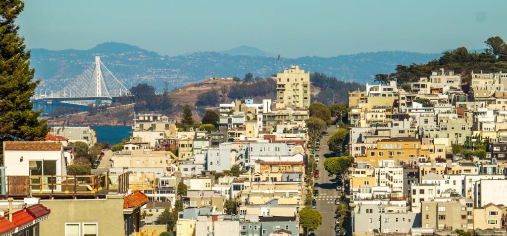 Hillside San Francisco neighborhood with the Bay Bridge in the distance