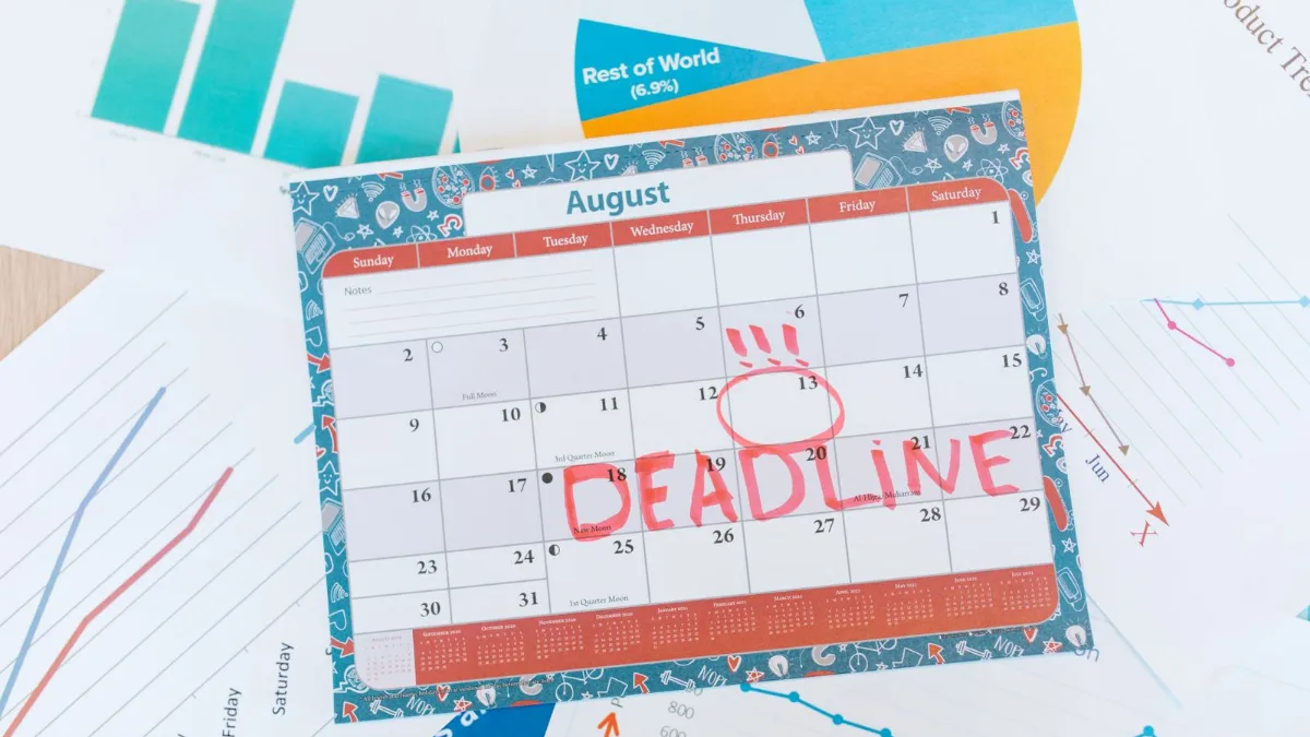 A calendar with a deadline circled in red beside paperwork