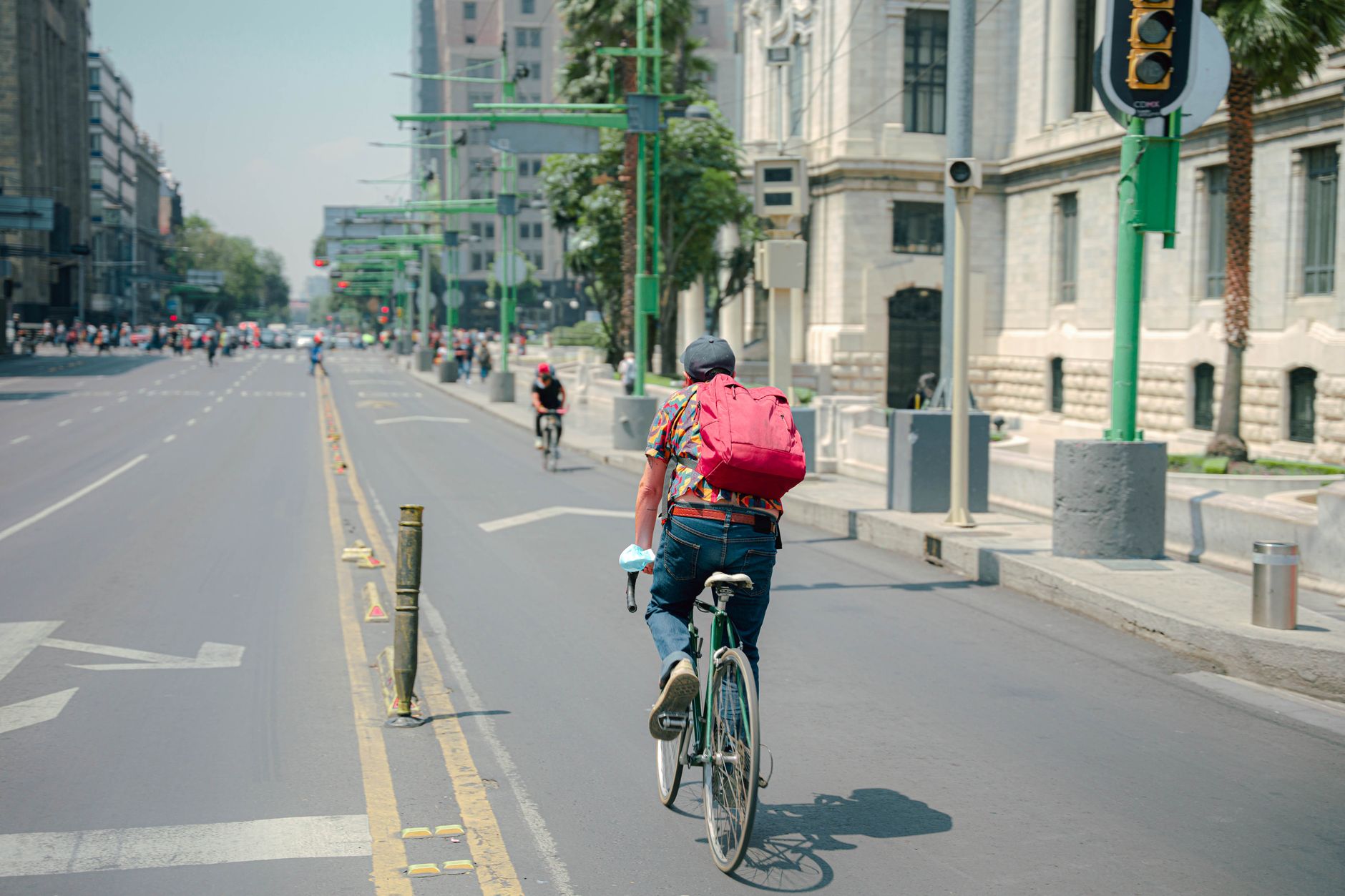 A painted bike lane beside a low-speed city street where hoverboard riding is permitted