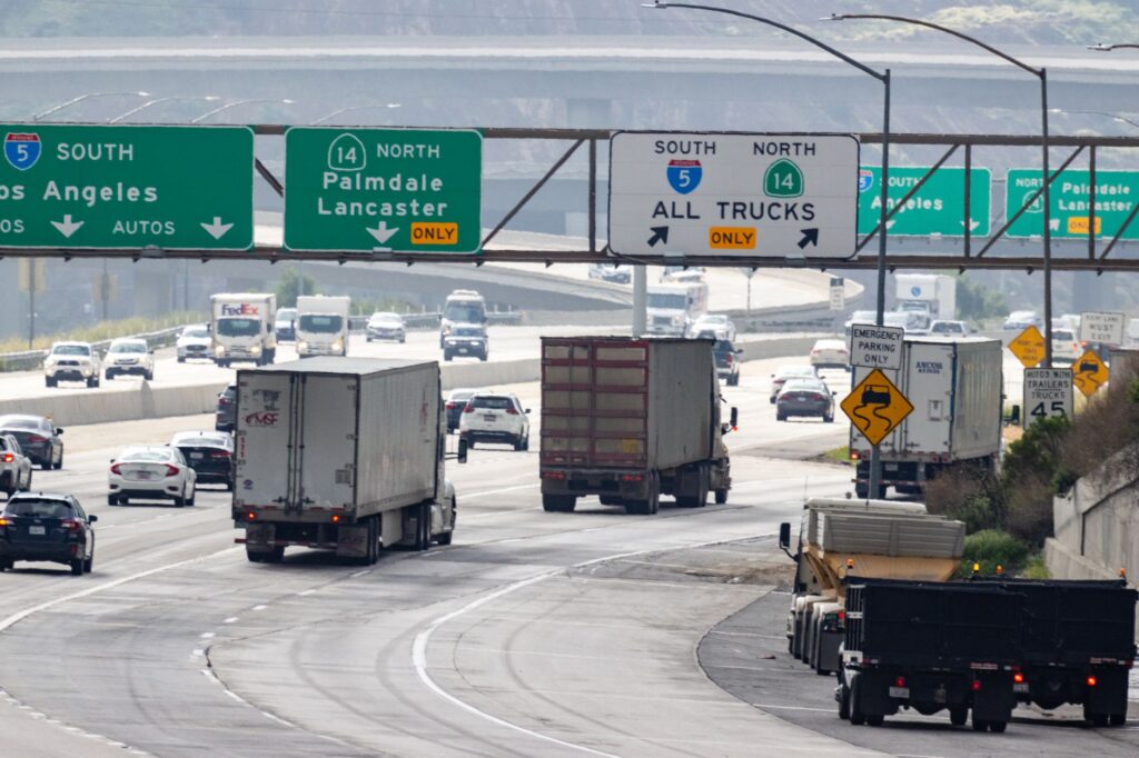 Multiple lanes of traffic on a California freeway on a clear day