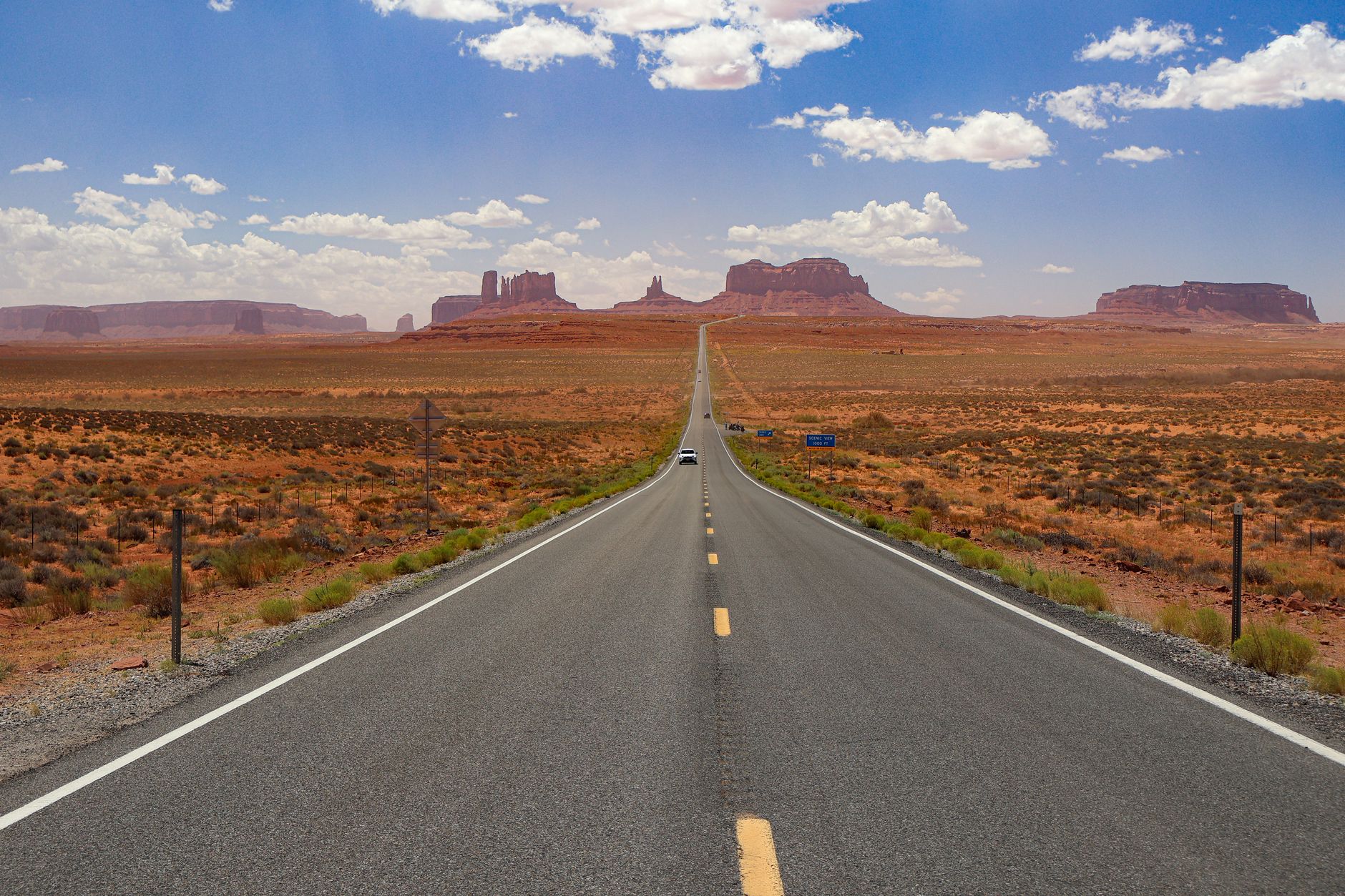 An open desert highway stretching toward the horizon