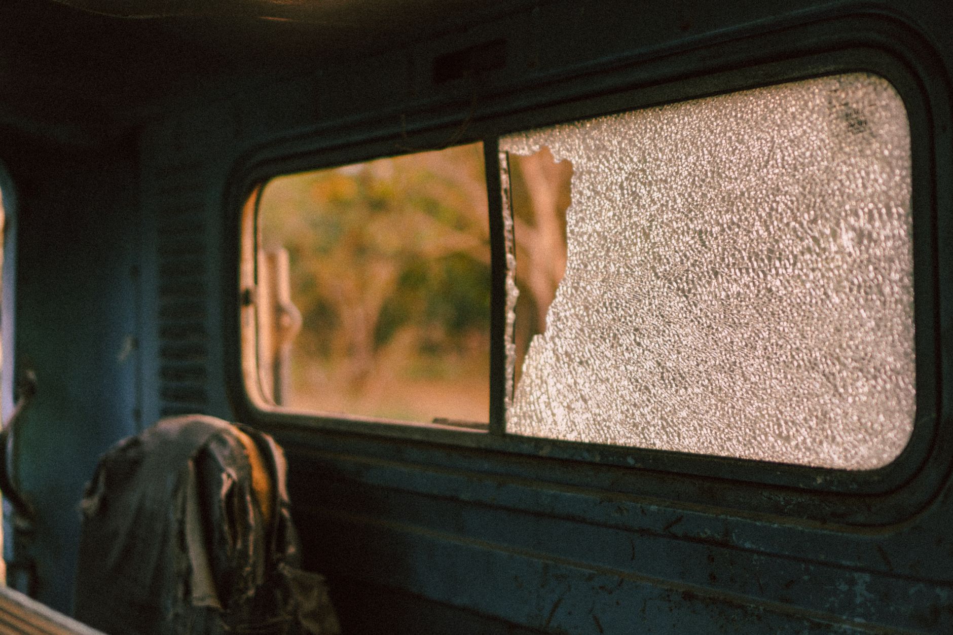 Shattered safety glass in a damaged vehicle window