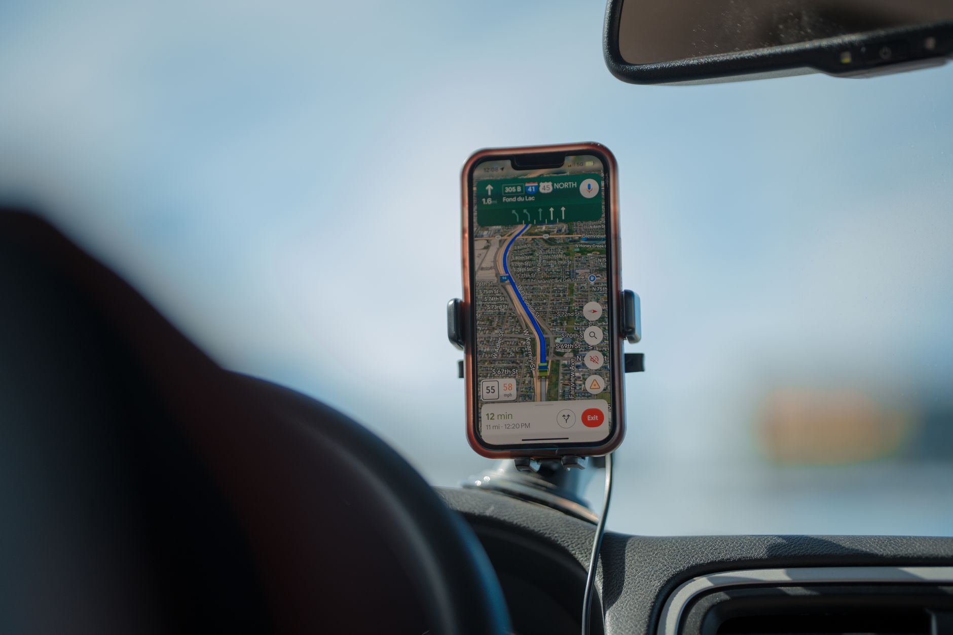 A navigation app running on a phone mounted in a car
