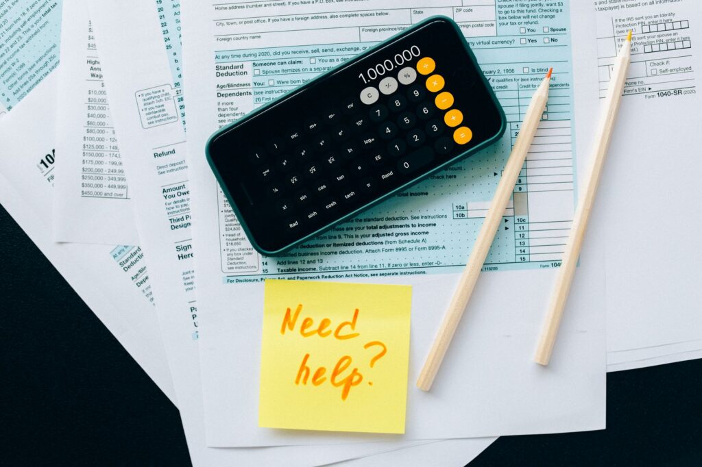 Tax forms and a calculator on a desk