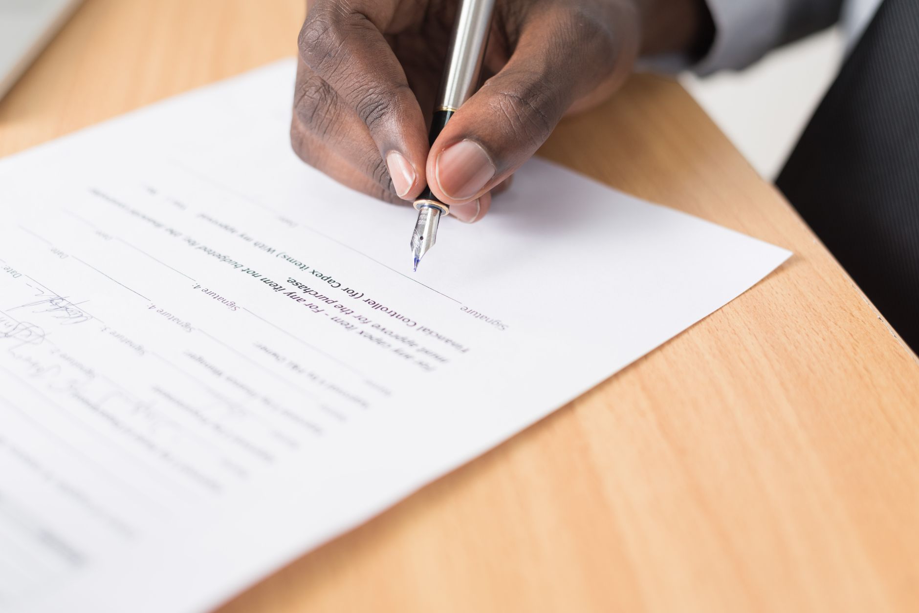 A rider reading an insurance release document before signing it