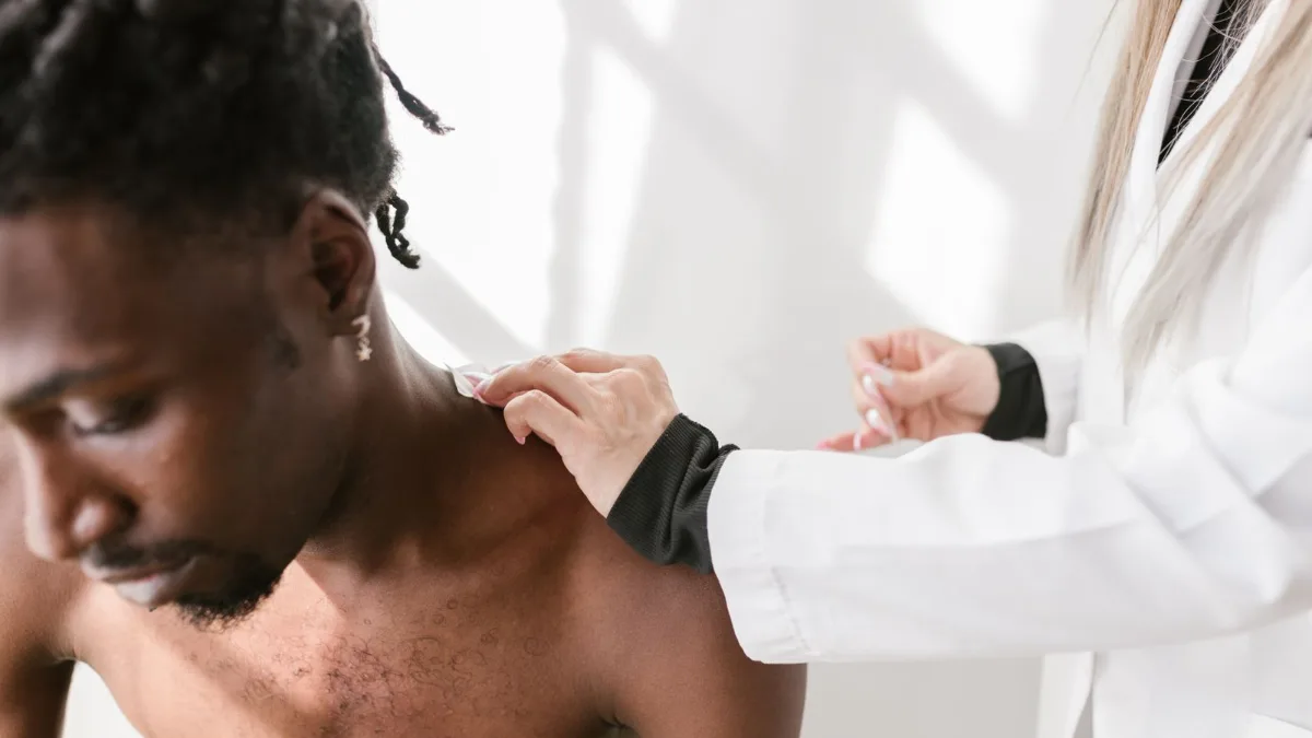 A therapist treating a patient's shoulder and upper back