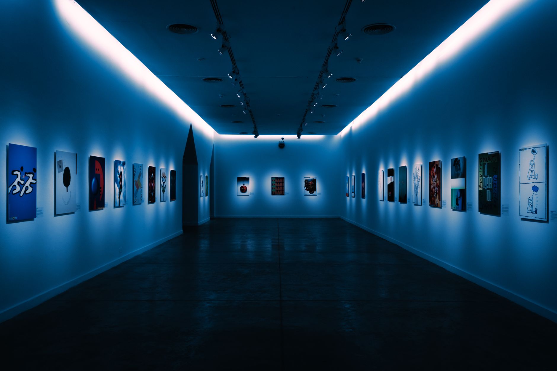 Quiet art museum gallery with framed works on the walls