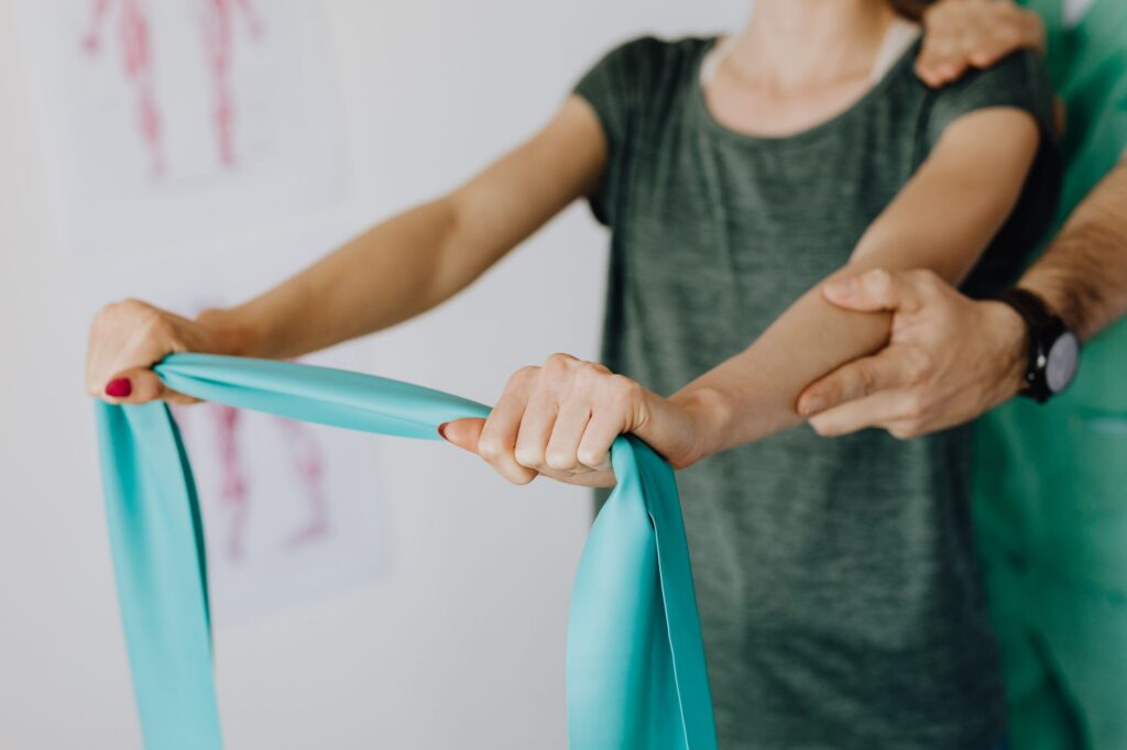 A person working through a physical therapy exercise during injury recovery