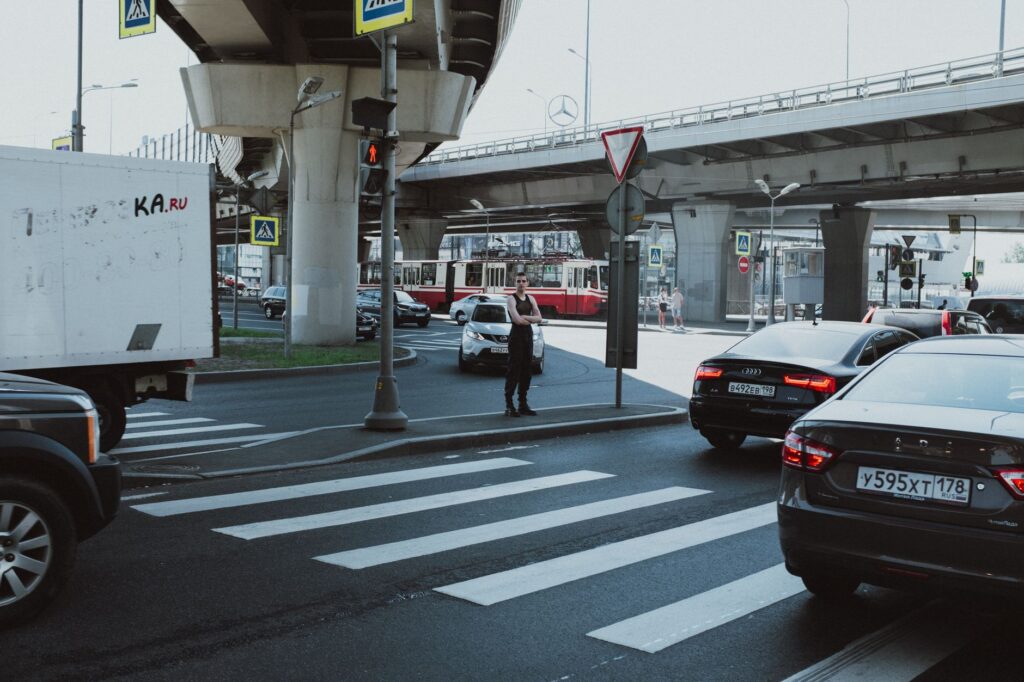 Vehicles crossing a busy urban intersection