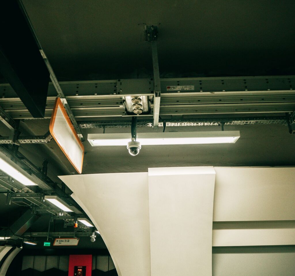 A security camera mounted in a parking structure